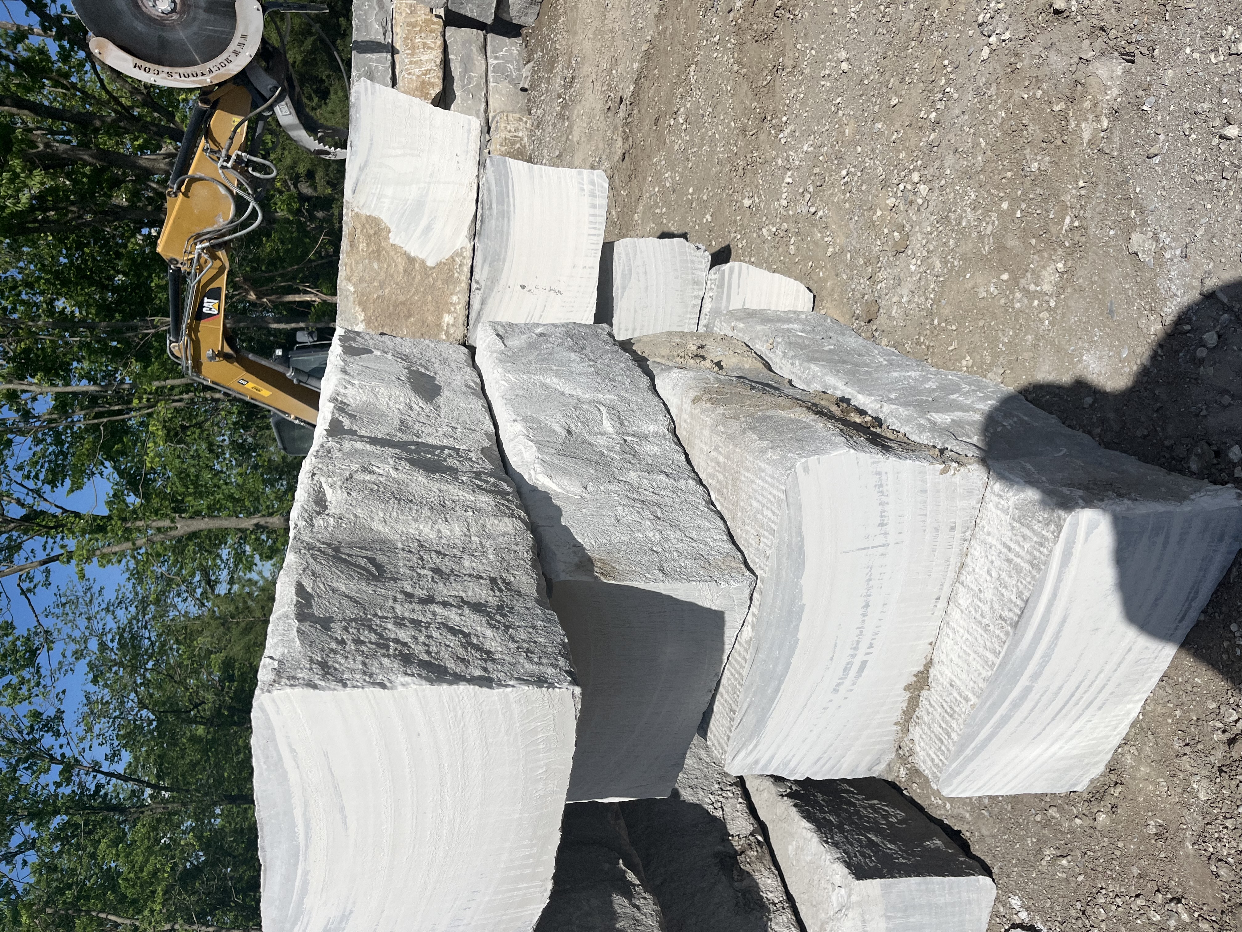 Milled gray limestone with sawn ends, stocked at the yard